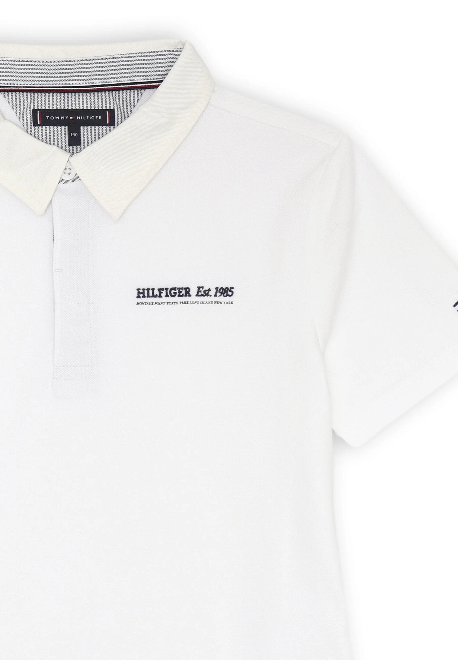 Polo bianca bambino Tommy Hilfiger con colletto panna e ricamo | CammarataMode