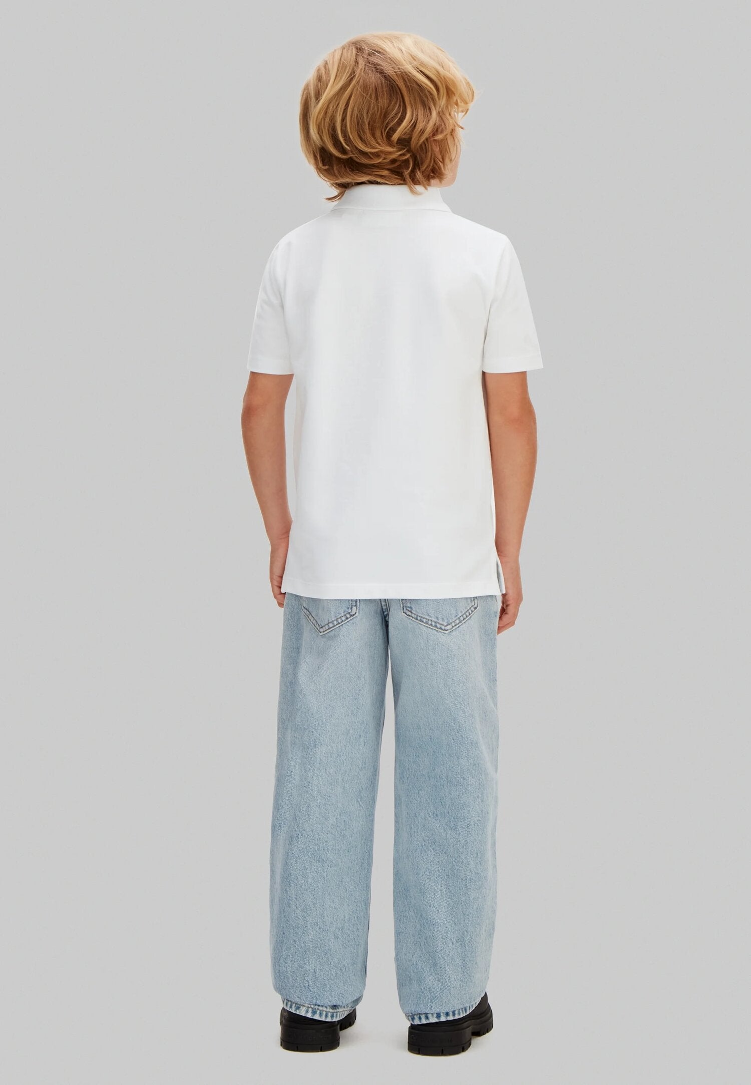 Calvin Klein Polo Bianca a Mezze Maniche Logo Piccolo Bambino LVCKSJB29BYAF_