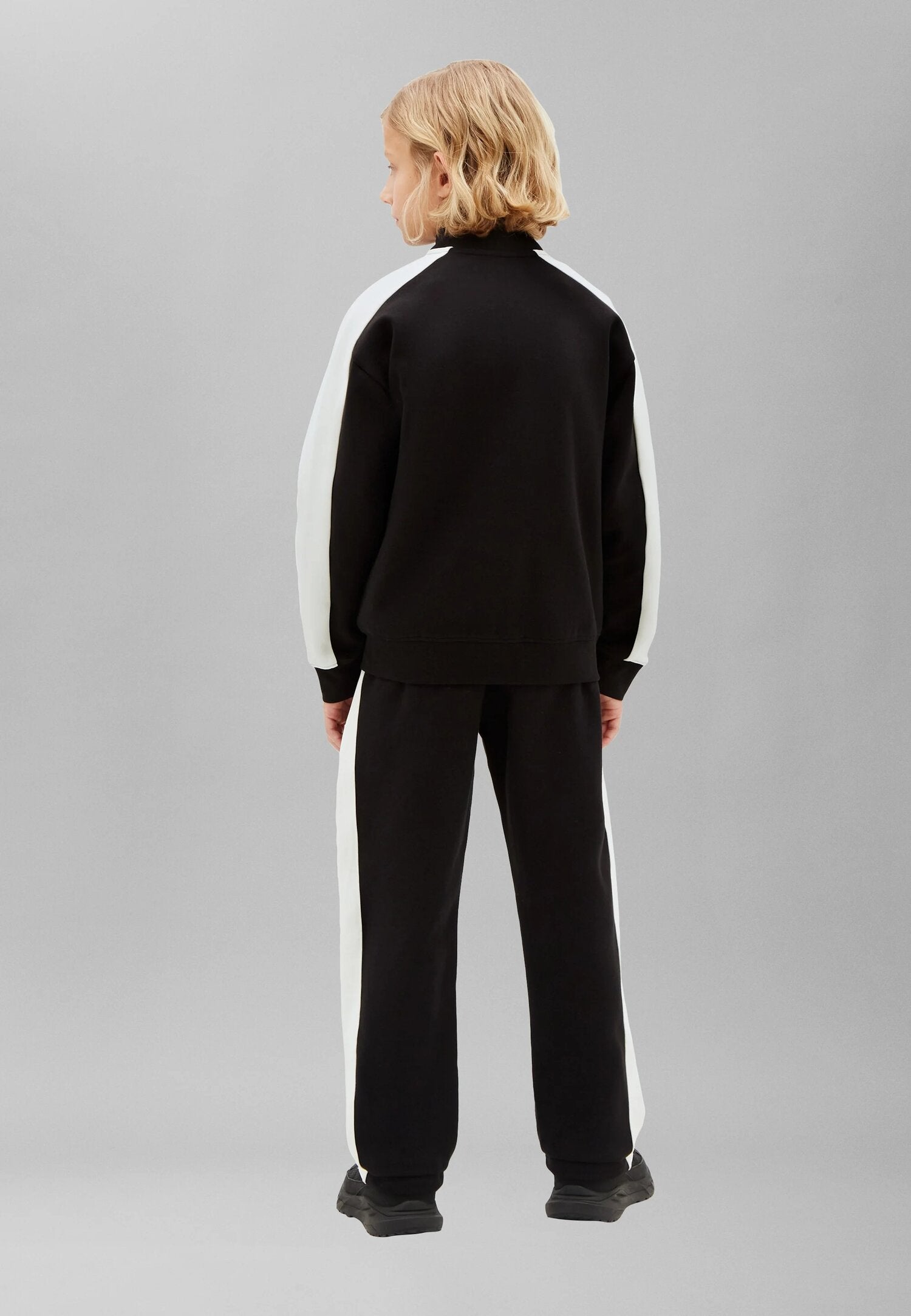 Calvin Klein Tuta Nera Con Giacca Zip Strisce Panna Bambino LVCKTJI17BBEH_